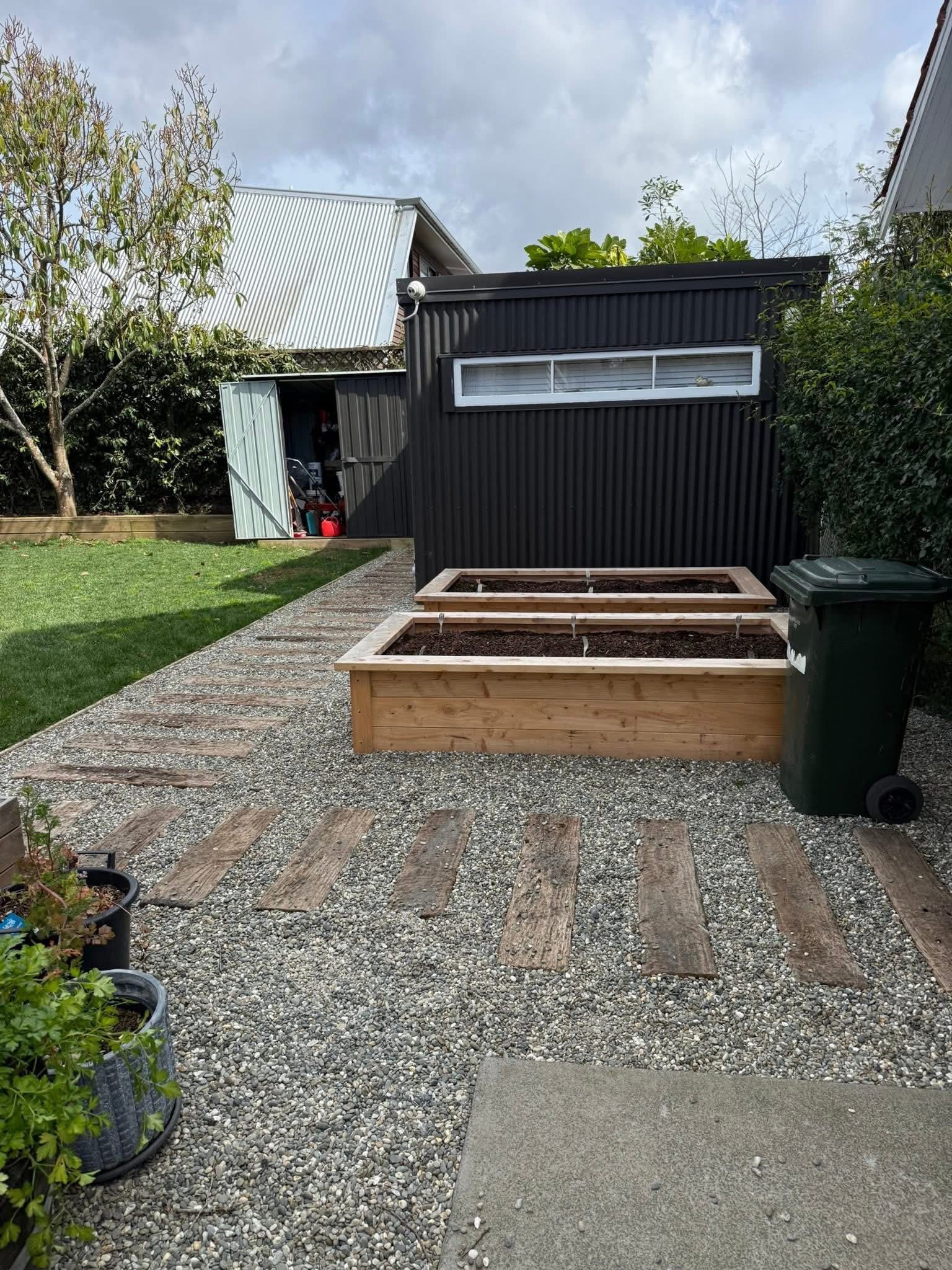 Raised timber garden beds with gravel courtyard and artificial lawn — Element Landscaping Waikato